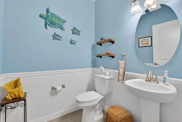 a view of a backyard with furniture and a grill