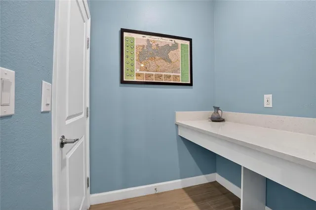 a view of a patio with couches table and chairs and potted plants