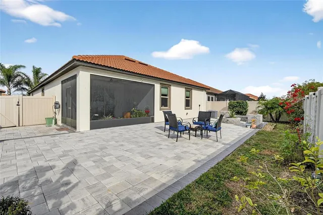 an aerial view of a house with yard space and lake view