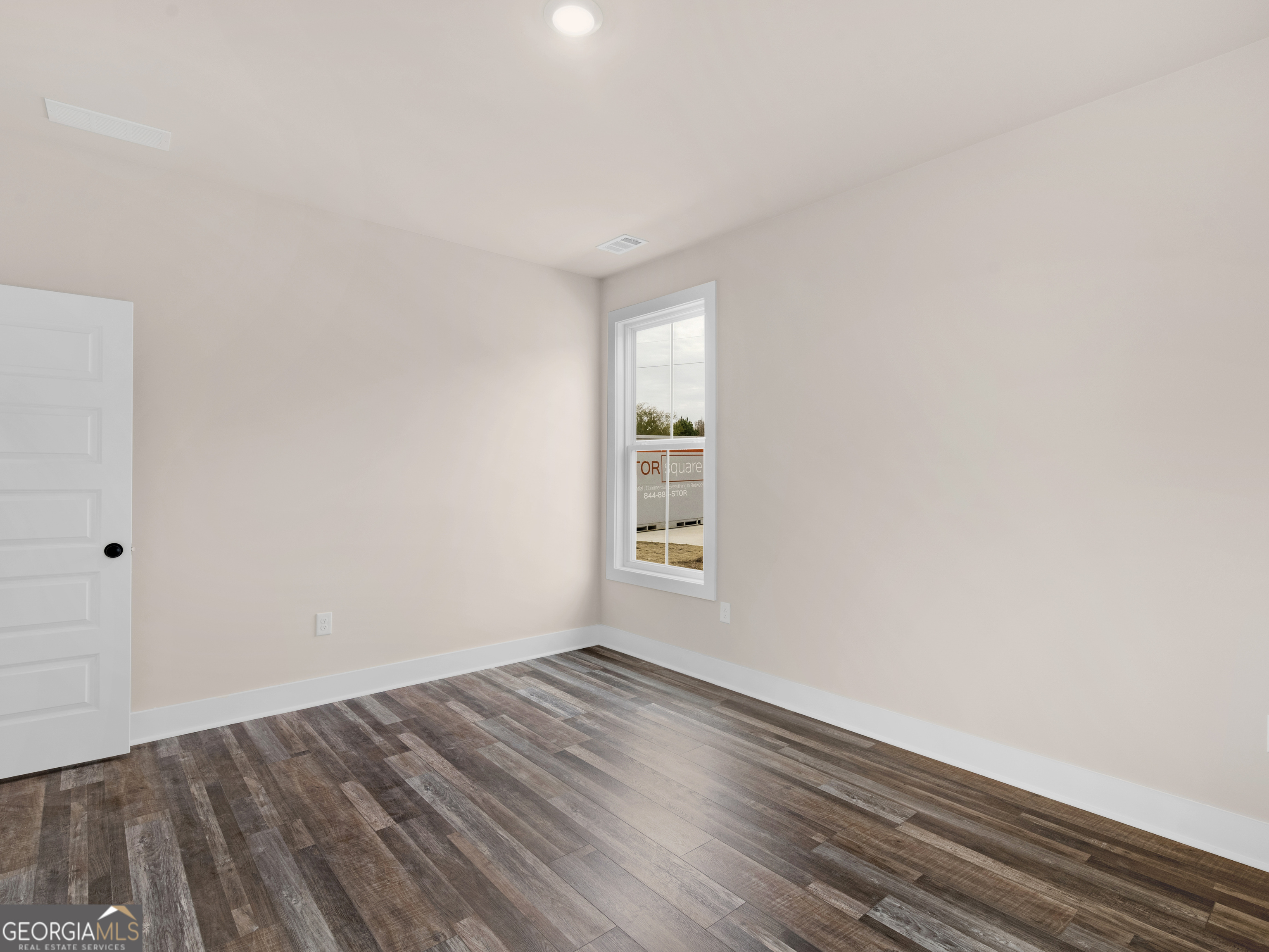160 Loyd Road Mansfield, GA 30056 - Photo 33 of 53 an empty room with wooden floor and windows