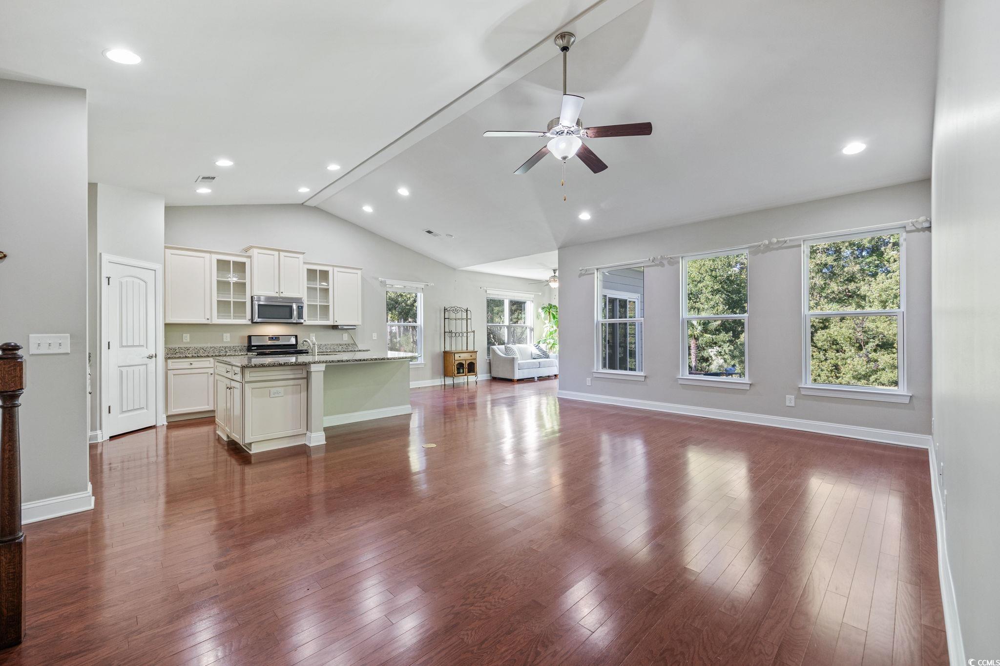 1900 Bluff Drive Myrtle Beach, SC 29577 - Photo 10 of 38 Unfurnished living room featuring dark wood-style flooring, recessed lighting, and a ceiling fan