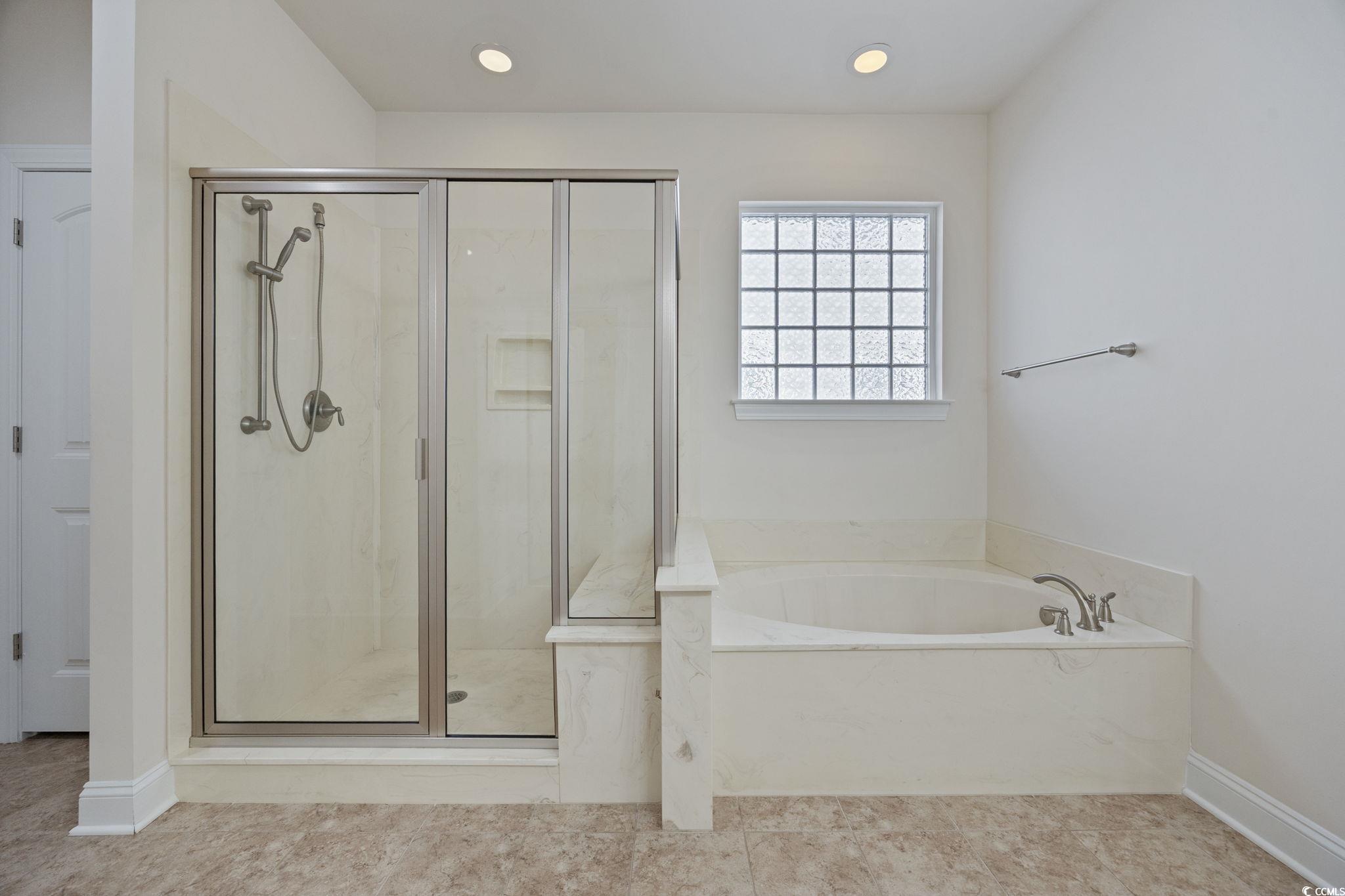 1900 Bluff Drive Myrtle Beach, SC 29577 - Photo 15 of 38 Full bathroom featuring a stall shower, a bath, recessed lighting, and tile patterned flooring