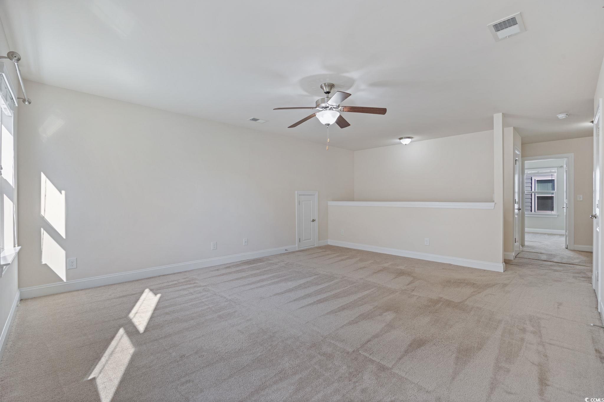 1900 Bluff Drive Myrtle Beach, SC 29577 - Photo 21 of 38 Unfurnished room featuring light colored carpet and a ceiling fan