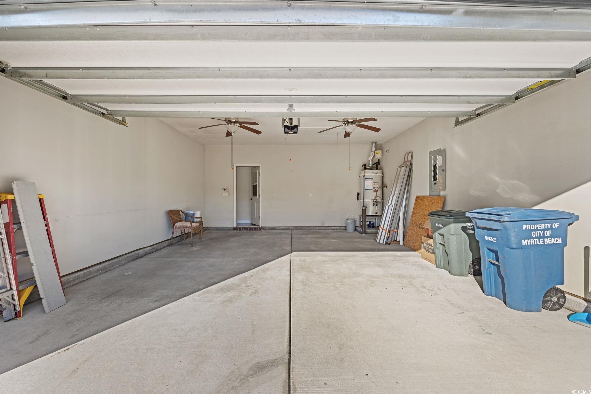 1900 Bluff Drive Myrtle Beach, SC 29577 - Photo 27 of 38 Garage with electric panel, gas water heater, and a ceiling fan