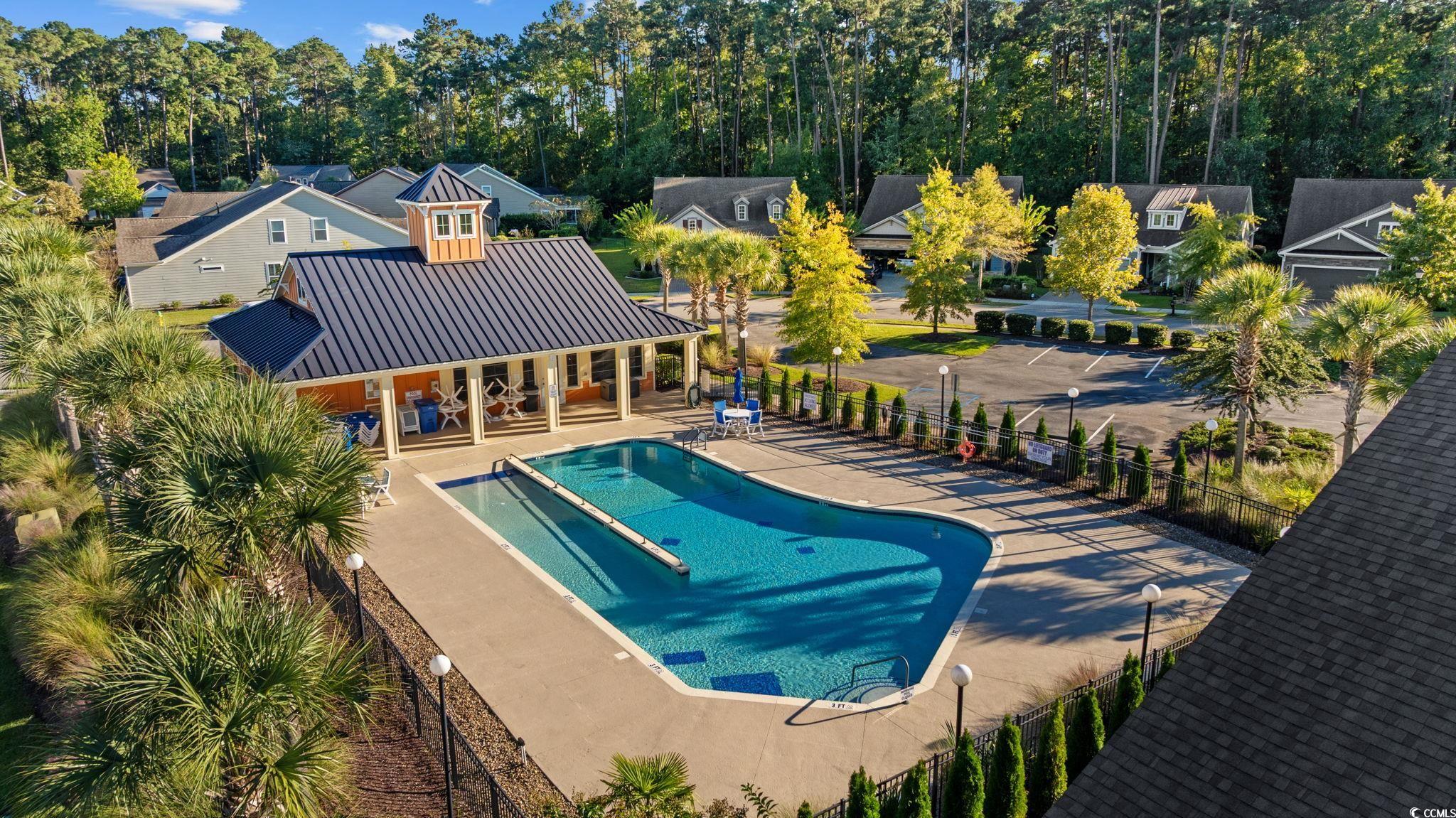 1900 Bluff Drive Myrtle Beach, SC 29577 - Photo 31 of 38 Community pool with a patio and a residential view
