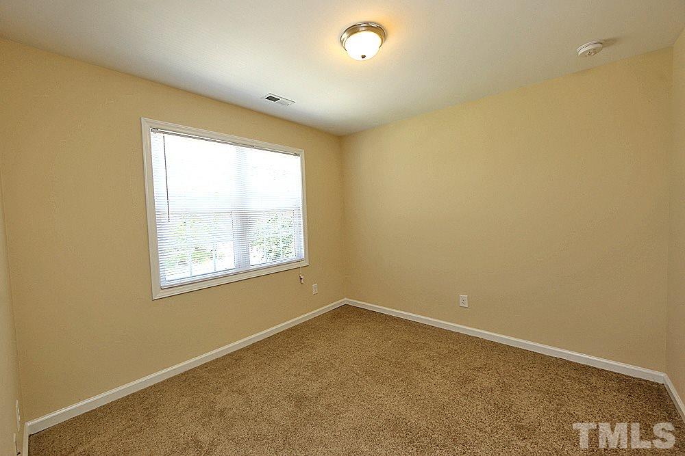 2014 Lime Street Durham, NC 27704 - Photo 15 of 17 an empty room with windows