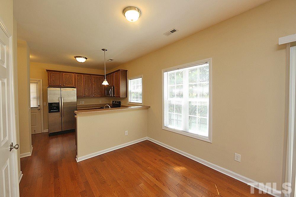 2014 Lime Street Durham, NC 27704 - Photo 5 of 17 a view of a kitchen with a sink wooden floor and a window