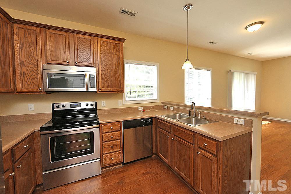 2014 Lime Street Durham, NC 27704 - Photo 7 of 17 a kitchen with a sink stove and microwave