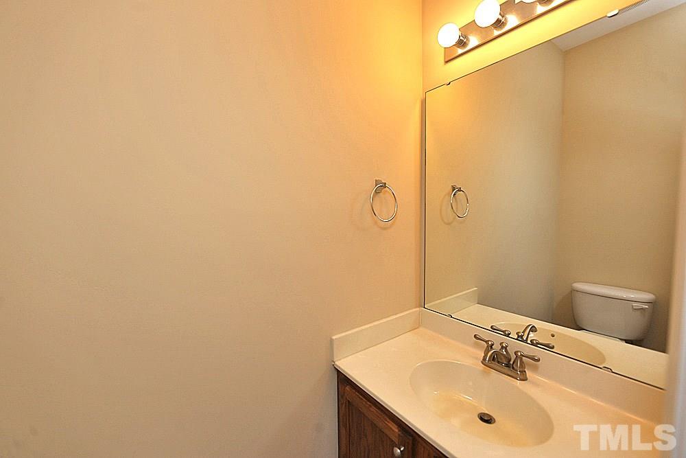 2014 Lime Street Durham, NC 27704 - Photo 10 of 17 a bathroom with a sink and a mirror