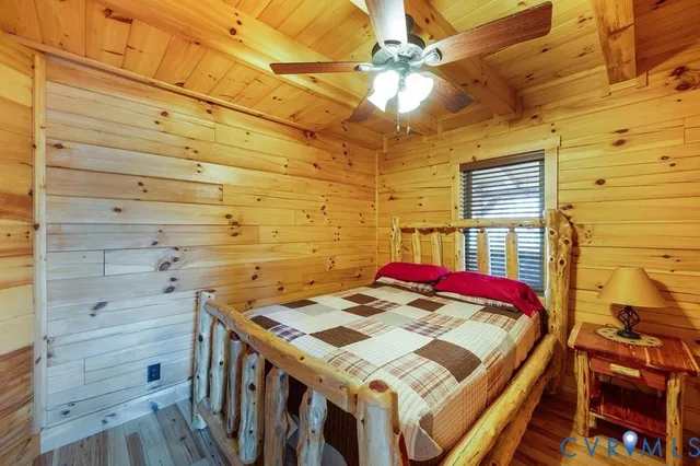 a view of a balcony with furniture and wooden floor