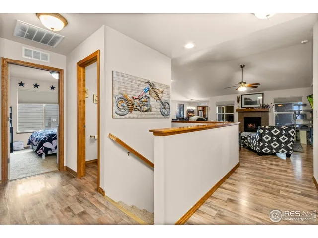 a living room with stainless steel appliances kitchen island granite countertop furniture and a view of kitchen