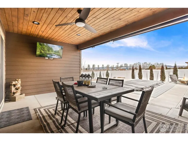 a view of a dinning table and chairs in the patio