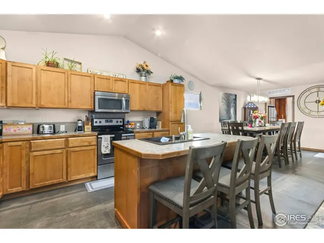 a kitchen with cabinets a sink and appliances