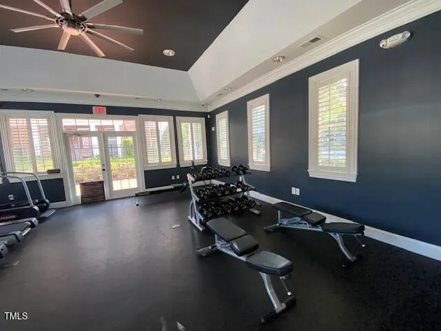 a room with gym equipment and a large window