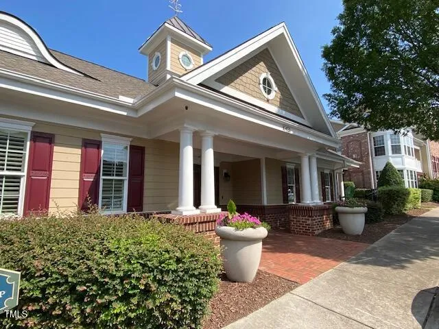 a front view of house with yard and seating space