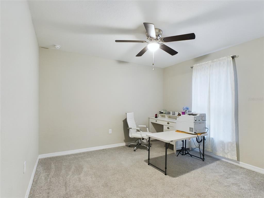 10102 Southwest 188th Circle Dunnellon, FL 34432 - Photo 13 of 17 a dining room with furniture and a window