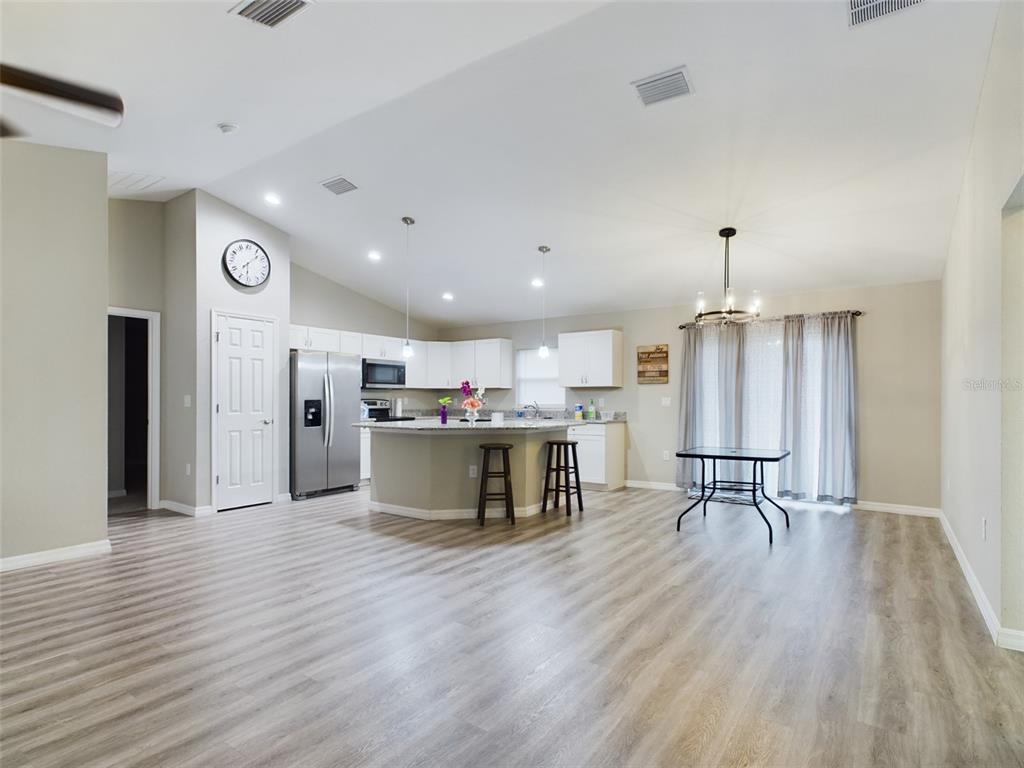 10102 Southwest 188th Circle Dunnellon, FL 34432 - Photo 3 of 17 a kitchen with kitchen island white cabinets and stainless steel appliances
