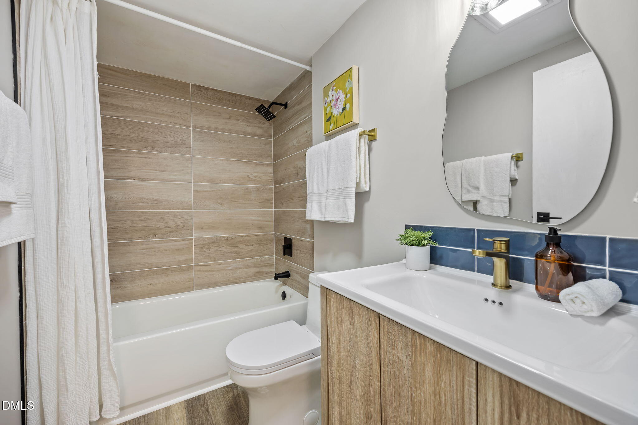 7809 Kitty Lane Raleigh, NC 27615 - Photo 11 of 29 a bathroom with a sink and a mirror