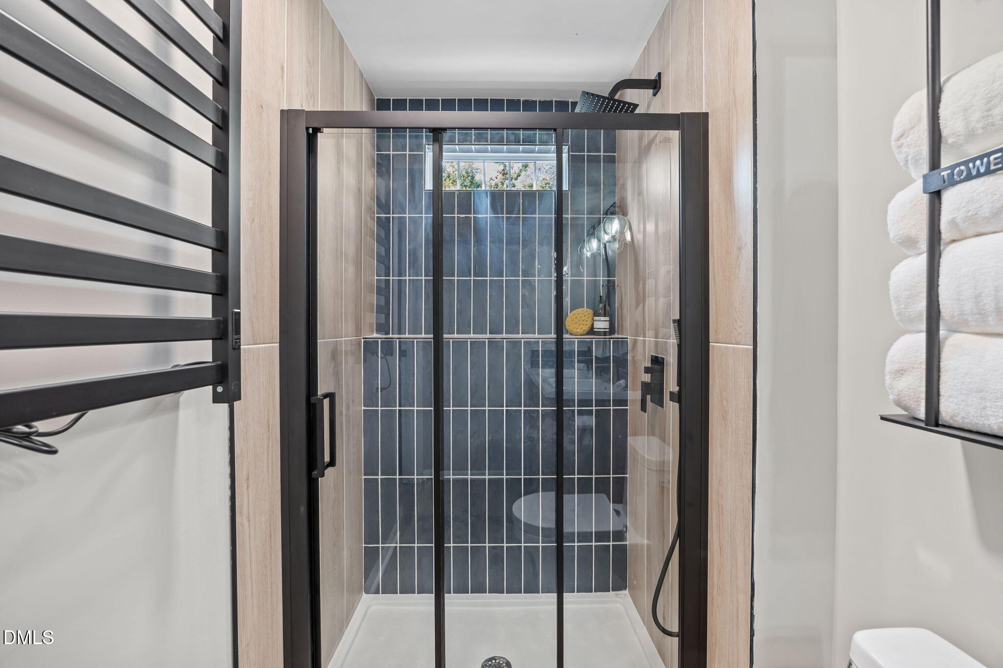 7809 Kitty Lane Raleigh, NC 27615 - Photo 18 of 29 a bathroom with a glass shower door