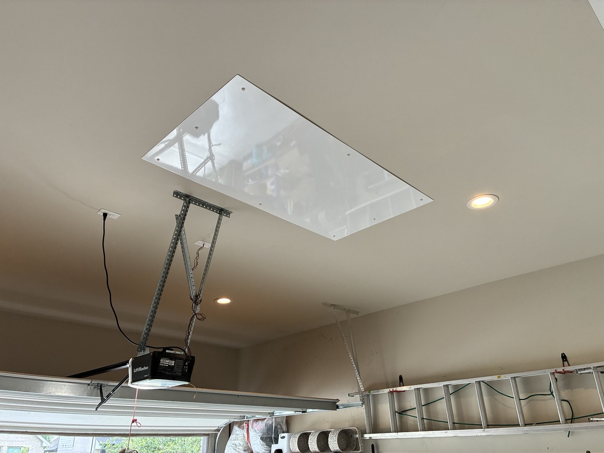 111 Yellow Perch Way Conroe, TX 77318 - Photo 36 of 37 Convenient overhead storage platform lifts up to 250 lbs, providing easy access to seasonal and household items.