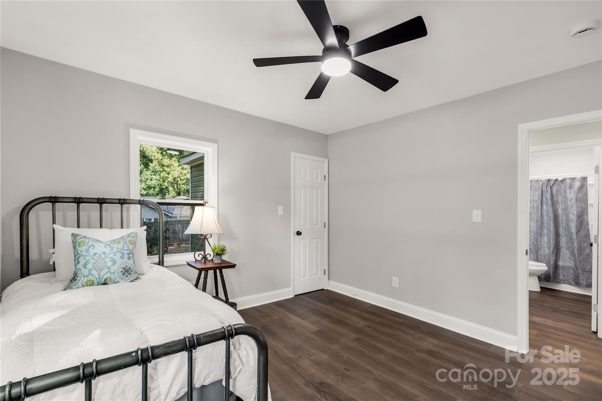 951 Confederate Avenue Lancaster, SC 29720 - Photo 19 of 29 a bedroom with a bed and wooden floor