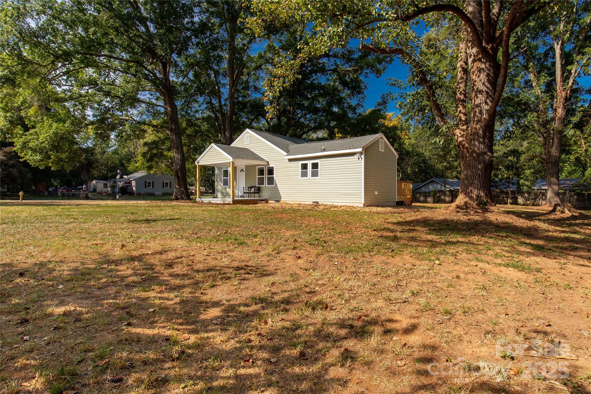 951 Confederate Avenue Lancaster, SC 29720 - Photo 26 of 29 a front view of a house with a yard and trees