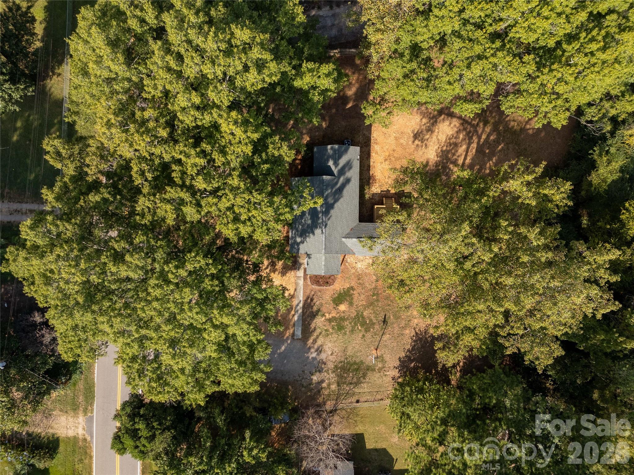 951 Confederate Avenue Lancaster, SC 29720 - Photo 29 of 29 a backyard of a building with large trees