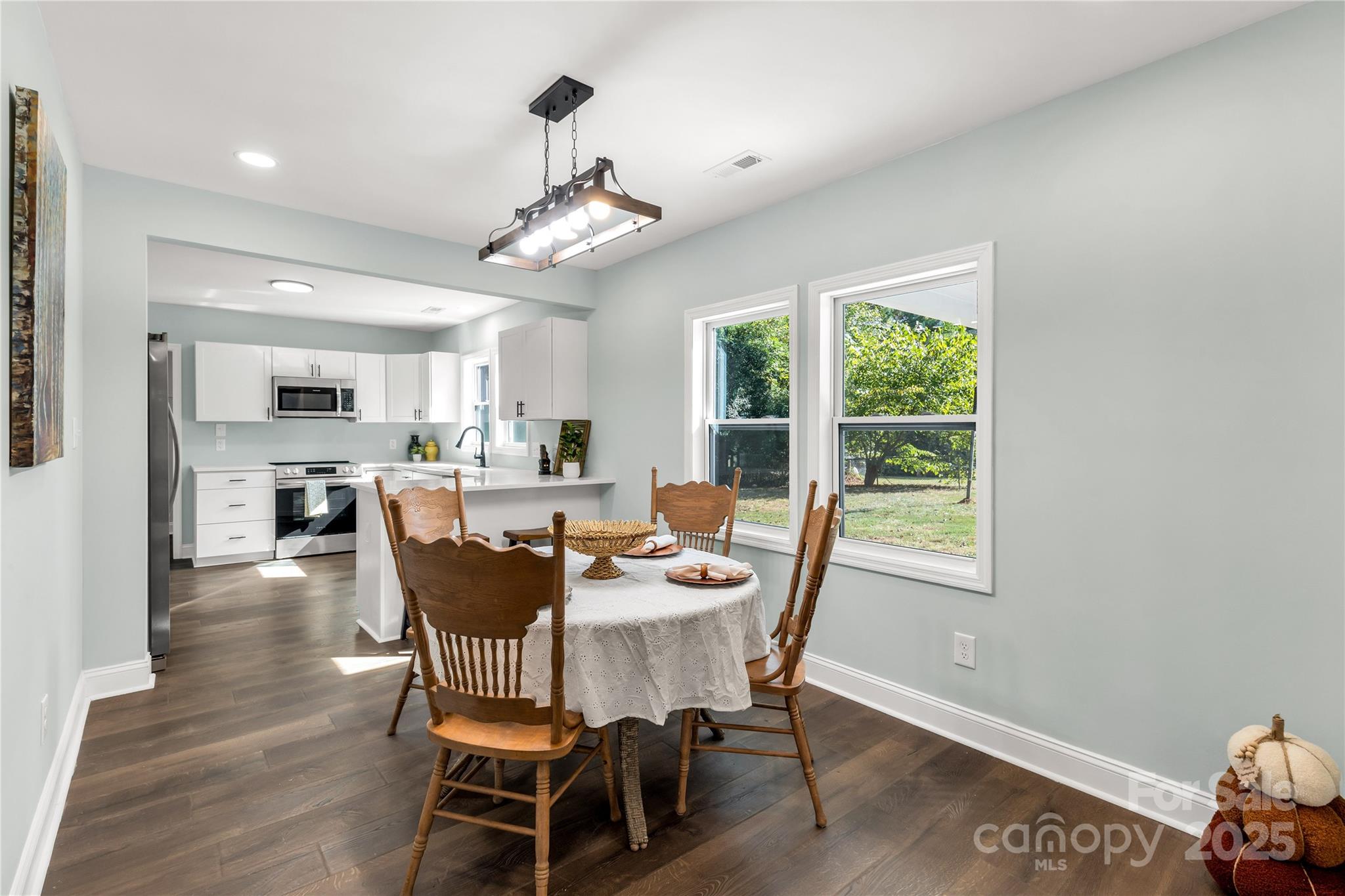 951 Confederate Avenue Lancaster, SC 29720 - Photo 9 of 29 a dining room with furniture a window and wooden floor