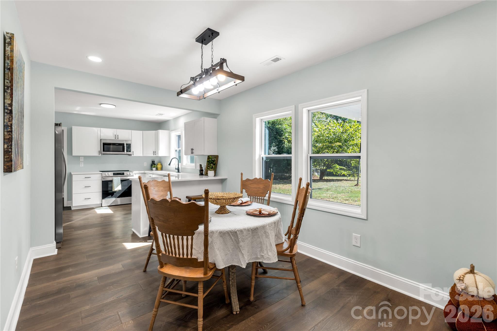 951 Confederate Avenue Lancaster, SC 29720 - Photo 10 of 29 a dining room with furniture a window and wooden floor