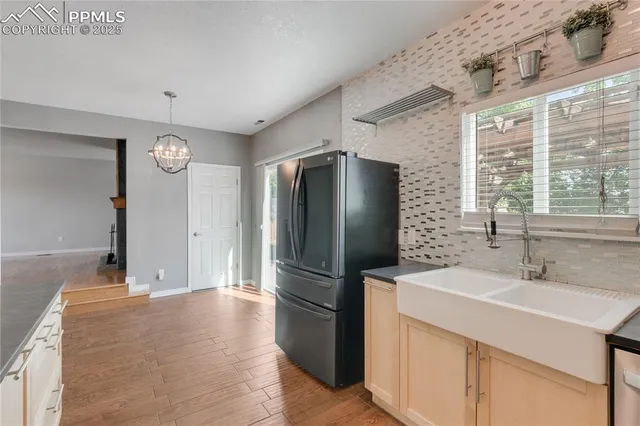 a kitchen with stainless steel appliances a refrigerator and a sink