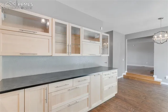 a view of a kitchen cabinets and wooden floor