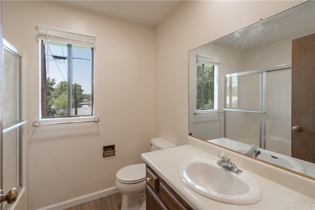 9176 Tiburon Circle, Unit 3 Atascadero, CA 93422 - Photo 9 of 16 Full bath with tub/shower, new sliding glass doors and flooring. Large mirror and medicine cabinet.