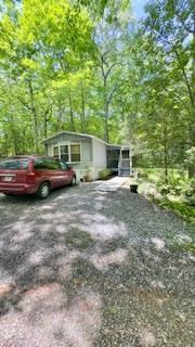 19 My Own Road Blairsville, GA 30512 - Photo 2 of 16 a view of yard with trees in the background
