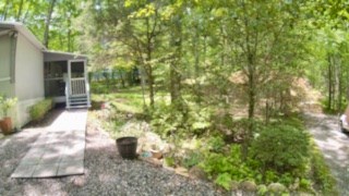 19 My Own Road Blairsville, GA 30512 - Photo 3 of 16 a backyard of a house with table and chairs