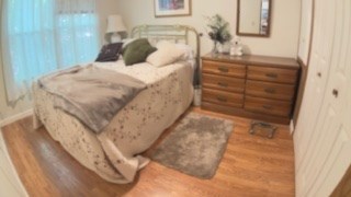 19 My Own Road Blairsville, GA 30512 - Photo 10 of 16 a bedroom with a bed and a mirror on the dresser
