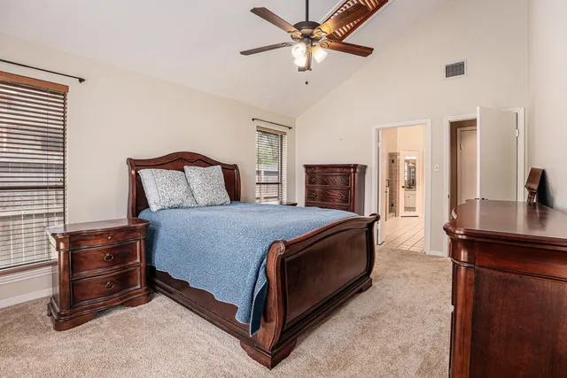 a bed room with a bed and a television