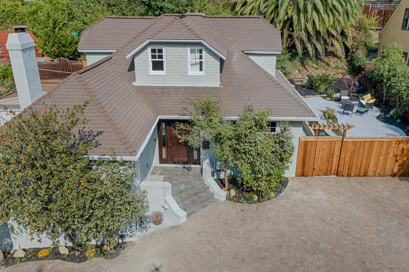 101 Tunnel Road Berkeley, CA 94705 - Photo 1 of 34 a aerial view of a house with a yard and potted plants