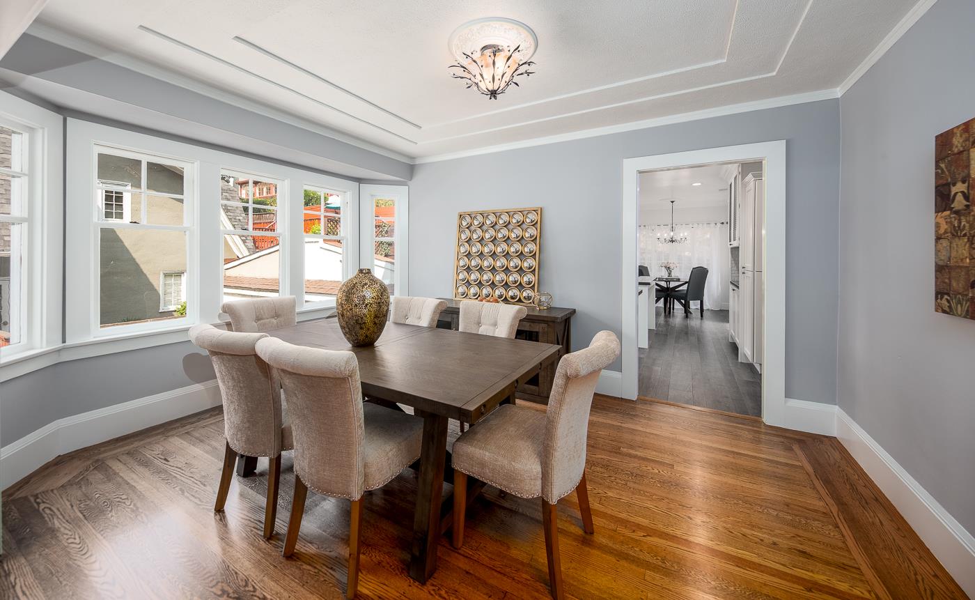 101 Tunnel Road Berkeley, CA 94705 - Photo 11 of 34 a view of a dining room with furniture window and wooden floor