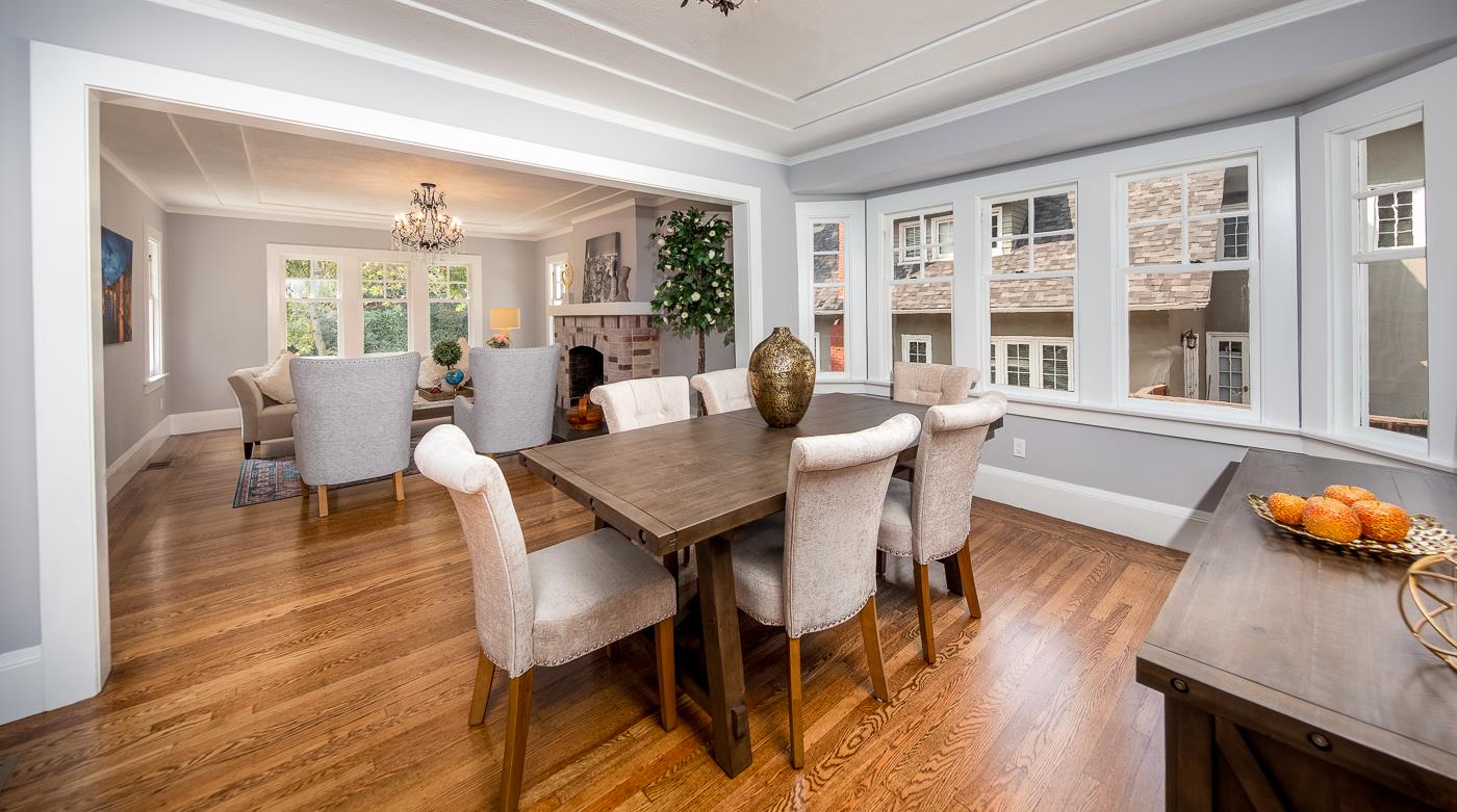 101 Tunnel Road Berkeley, CA 94705 - Photo 12 of 34 a dining room with wooden floor and large windows