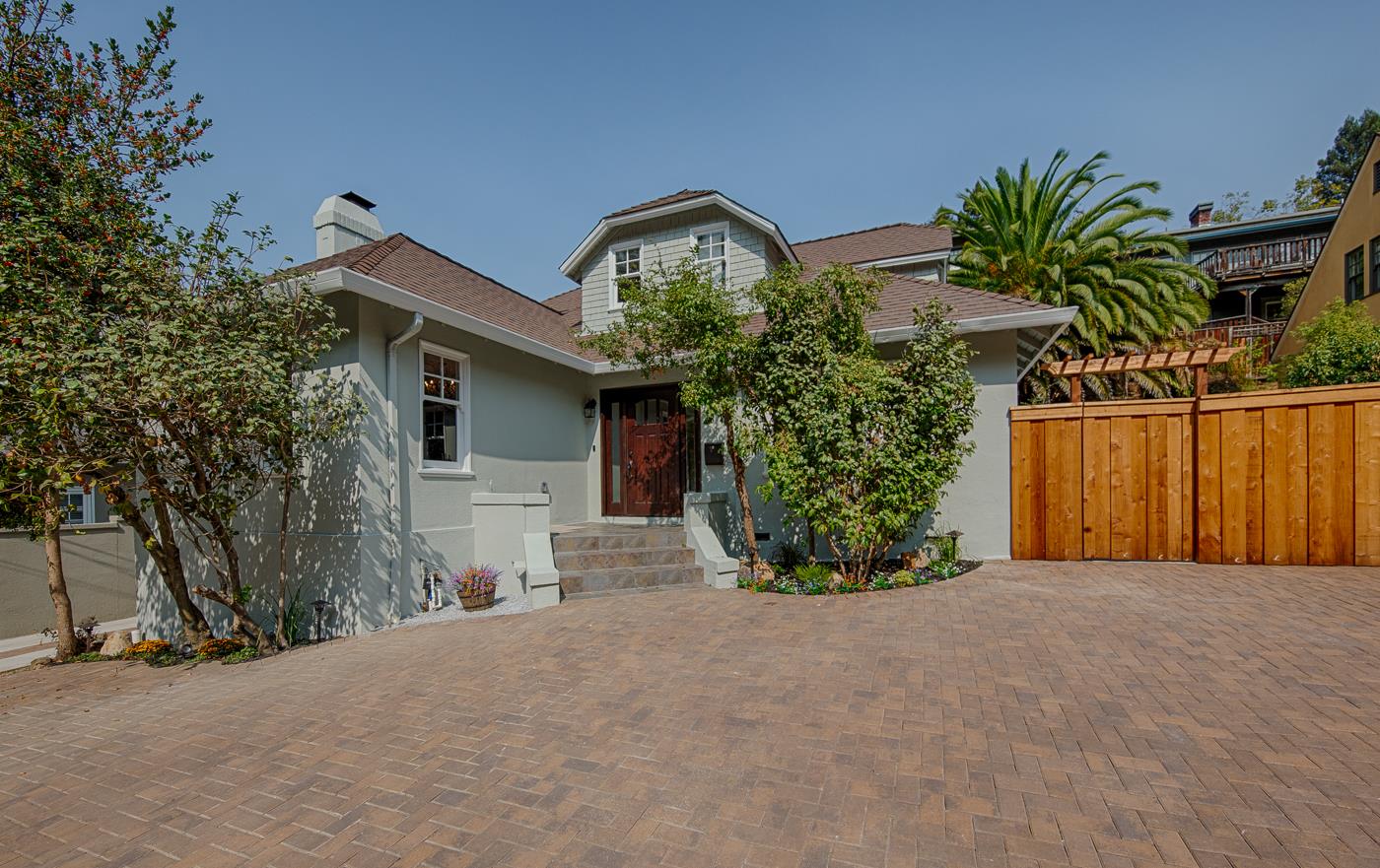 101 Tunnel Road Berkeley, CA 94705 - Photo 2 of 34 a front view of a house with a yard and garage