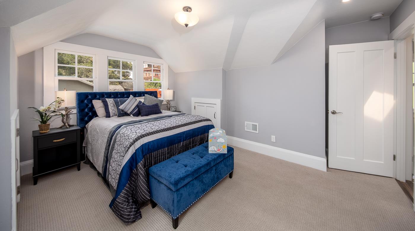 101 Tunnel Road Berkeley, CA 94705 - Photo 23 of 34 a bed room with a bed and a large window