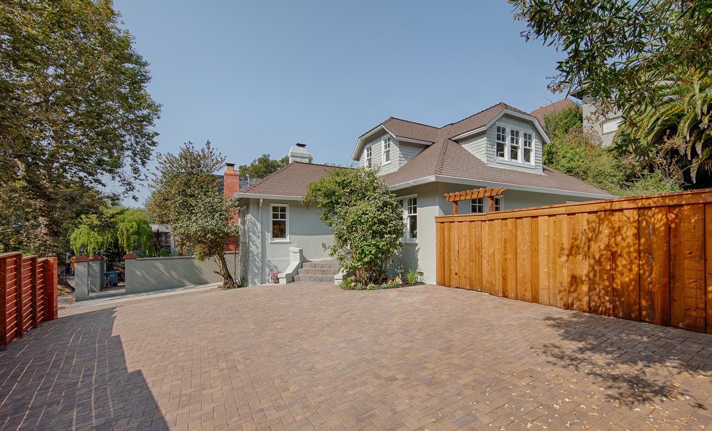 101 Tunnel Road Berkeley, CA 94705 - Photo 3 of 34 a front view of a house with a yard and garage