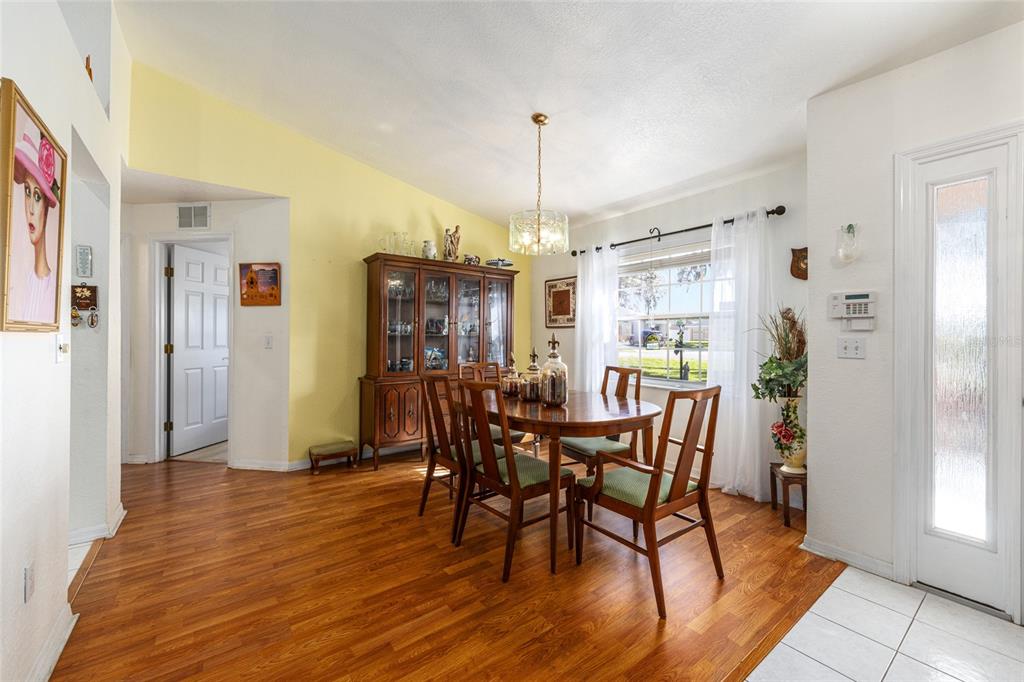 10090 Southwest 78th Court Ocala, FL 34476 - Photo 11 of 52 a view of a dining room with furniture and window