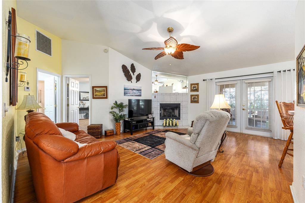 10090 Southwest 78th Court Ocala, FL 34476 - Photo 14 of 52 a living room with furniture and a fireplace
