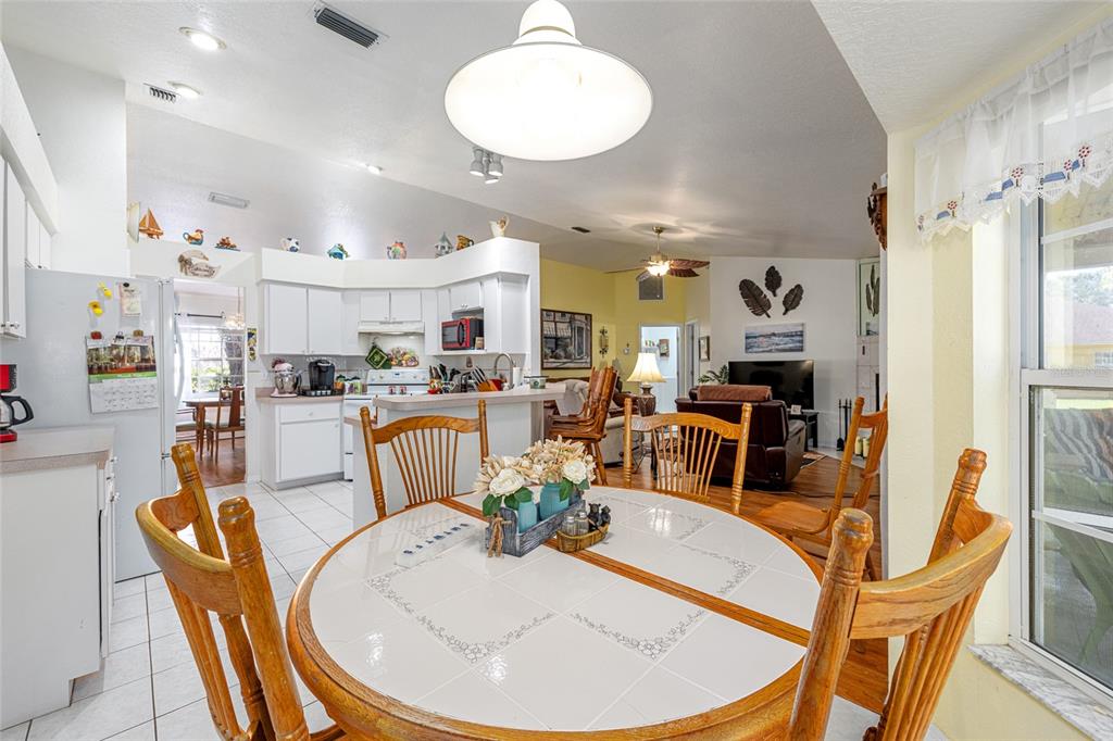 10090 Southwest 78th Court Ocala, FL 34476 - Photo 23 of 52 a view of a dining room with furniture