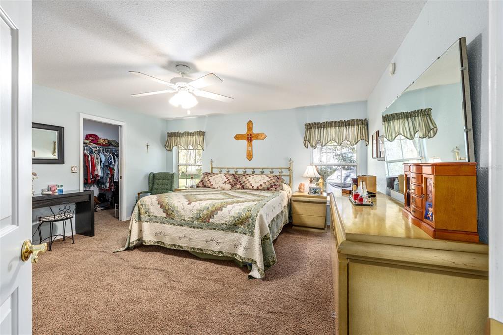 10090 Southwest 78th Court Ocala, FL 34476 - Photo 24 of 52 a bedroom with bed and window
