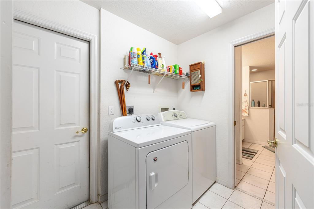 10090 Southwest 78th Court Ocala, FL 34476 - Photo 30 of 52 a spacious bathroom with a sink and a mirror