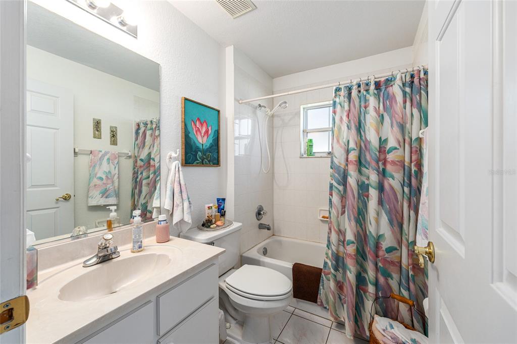 10090 Southwest 78th Court Ocala, FL 34476 - Photo 35 of 52 a bathroom with a sink toilet and shower