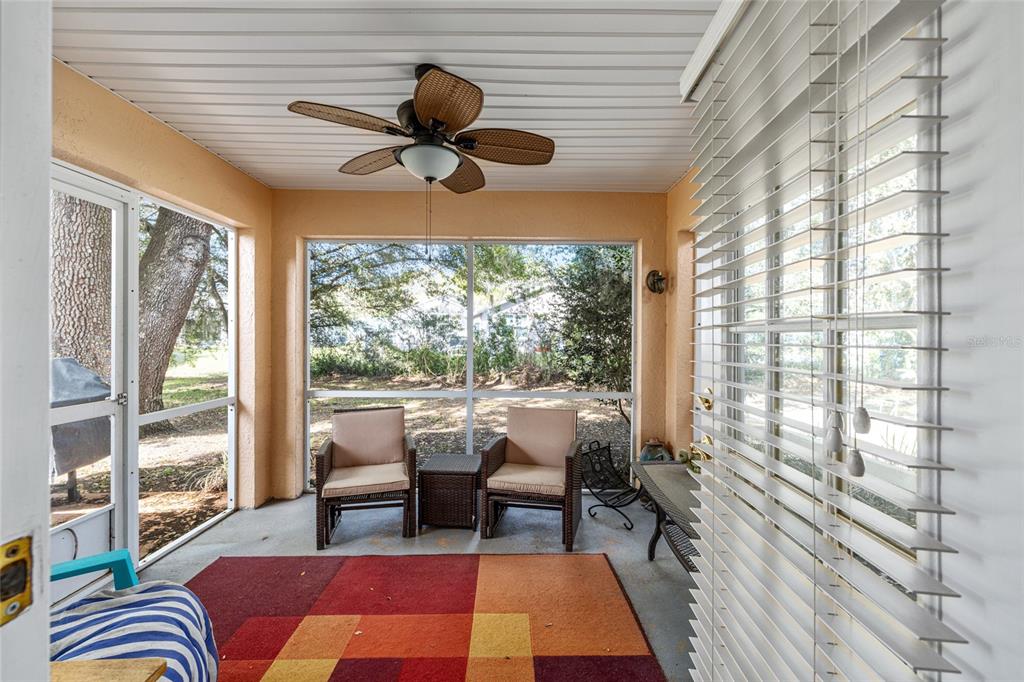 10090 Southwest 78th Court Ocala, FL 34476 - Photo 38 of 52 a living room with furniture and a large window