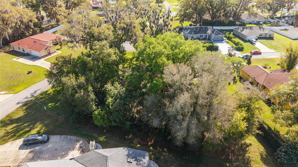 10090 Southwest 78th Court Ocala, FL 34476 - Photo 50 of 52 an aerial view of residential houses with outdoor space